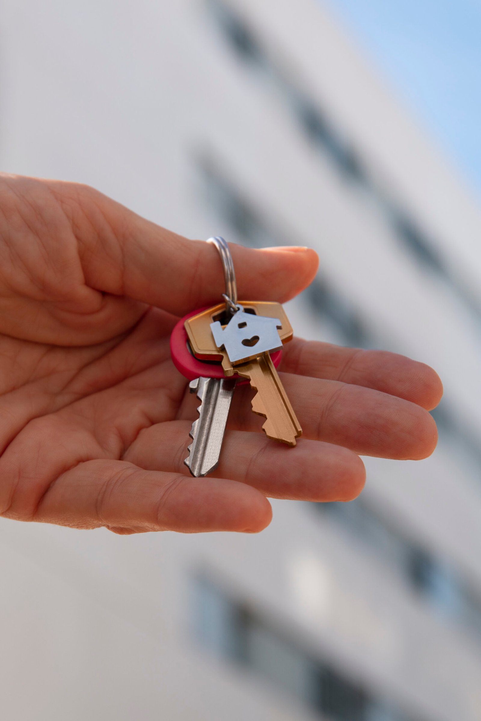 hand-holding-keys-outdoors